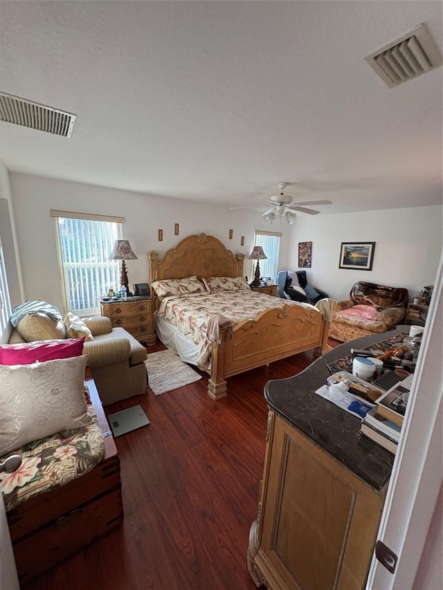 bedroom featuring ceiling fan and dark hardwood / wood-style flooring