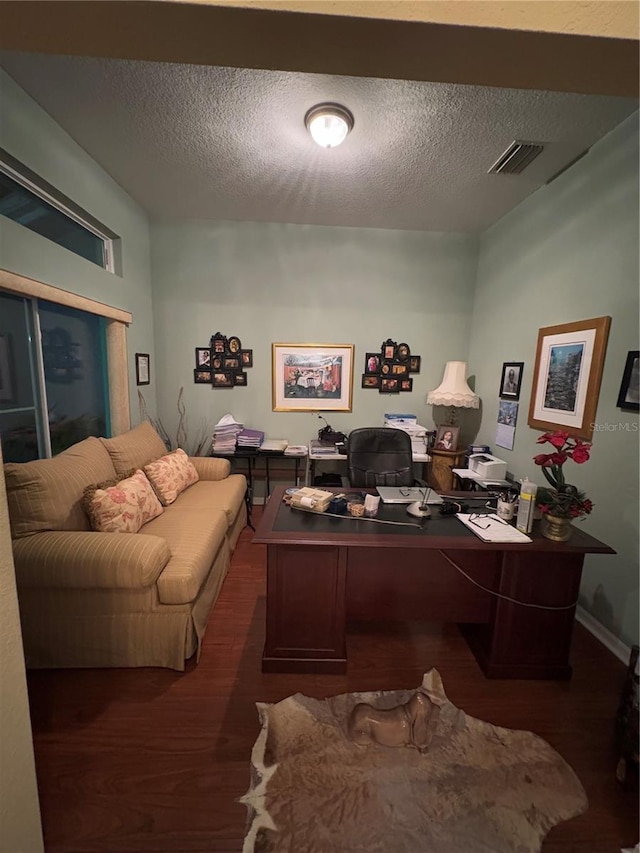 office space featuring dark hardwood / wood-style flooring and a textured ceiling