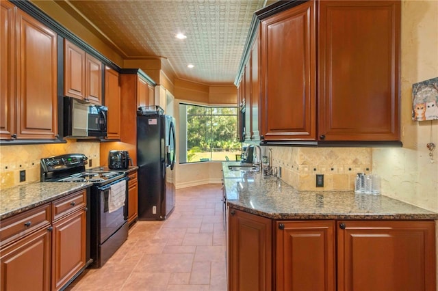 kitchen with black appliances, ornamental molding, sink, and stone counters