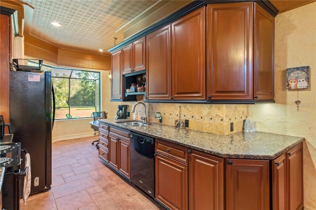 kitchen with stone counters, sink, and black appliances