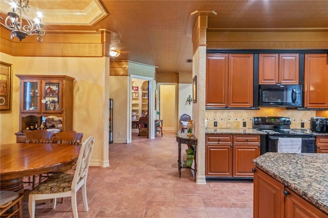 kitchen with stone counters, tasteful backsplash, crown molding, and black appliances