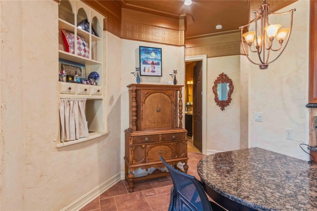 dining space with a chandelier