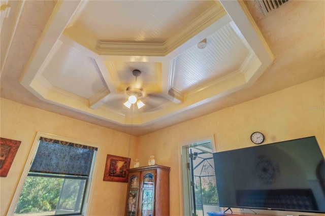 room details with ceiling fan, ornamental molding, and coffered ceiling