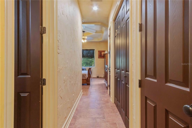 hallway featuring ornamental molding