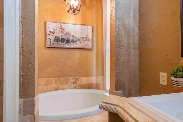 bathroom with a relaxing tiled tub