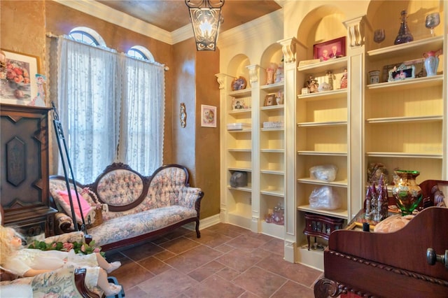 living area featuring ornamental molding