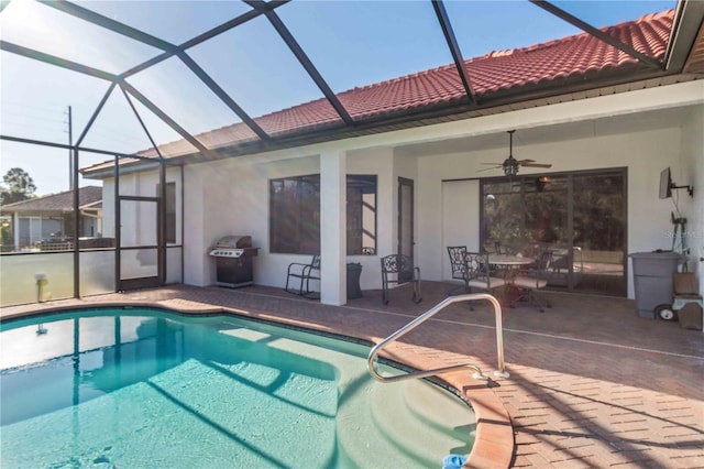 view of pool featuring ceiling fan, area for grilling, a lanai, and a patio