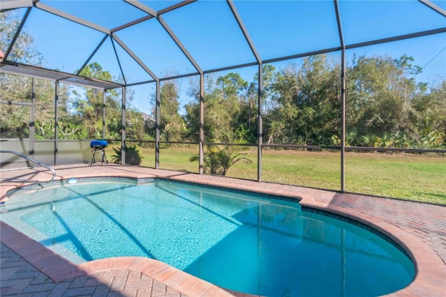 view of pool featuring a patio area and a lawn