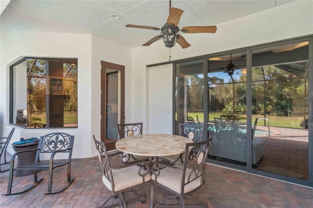 sunroom / solarium with ceiling fan