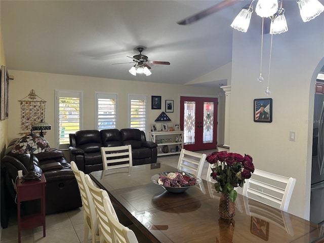 tiled dining space with french doors, ceiling fan, and vaulted ceiling