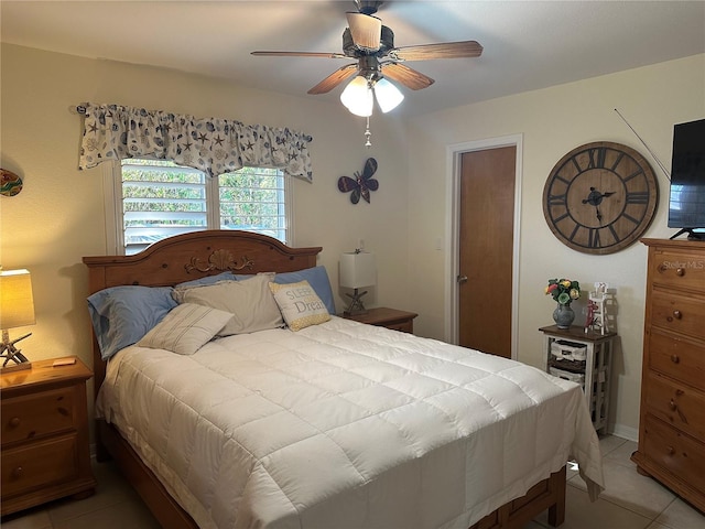 bedroom featuring tile patterned flooring and ceiling fan