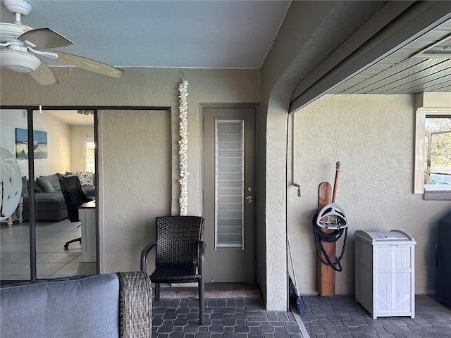 view of patio featuring ceiling fan