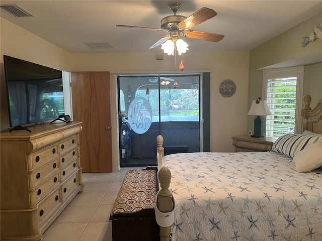 bedroom featuring ceiling fan, light tile patterned floors, and access to outside