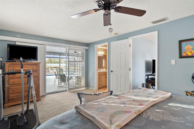 bedroom featuring connected bathroom, ceiling fan, a textured ceiling, access to outside, and carpet