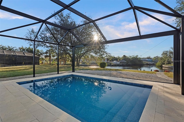 view of swimming pool with a lanai, a yard, and a water view