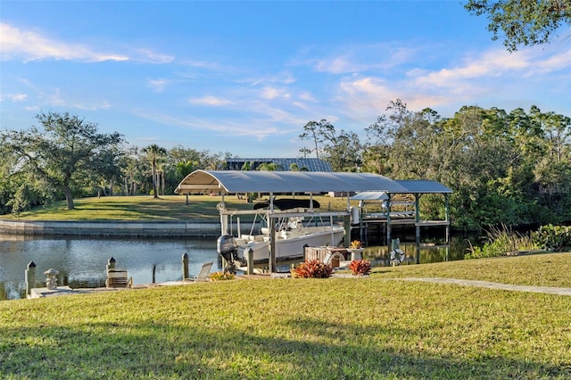 view of dock featuring a water view and a lawn