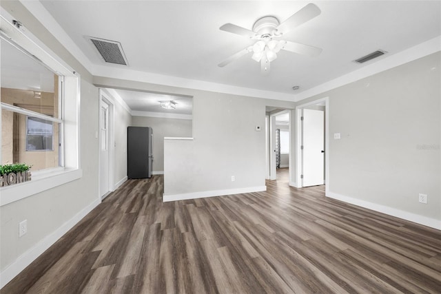 unfurnished living room with dark wood-type flooring and ceiling fan