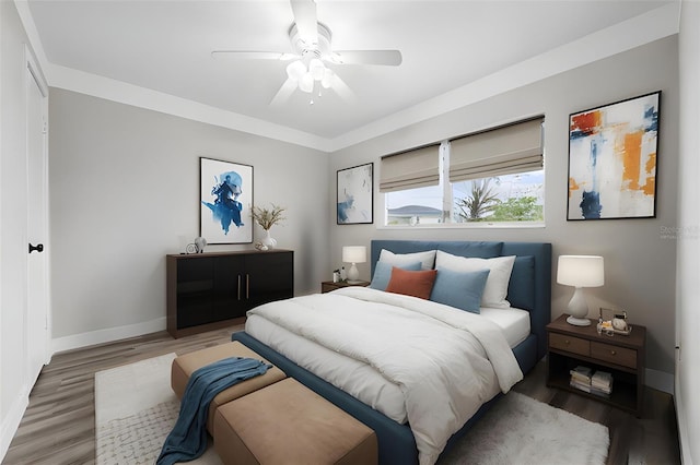 bedroom with ceiling fan and wood-type flooring