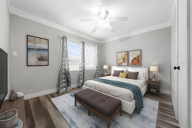 bedroom featuring dark hardwood / wood-style flooring and ceiling fan