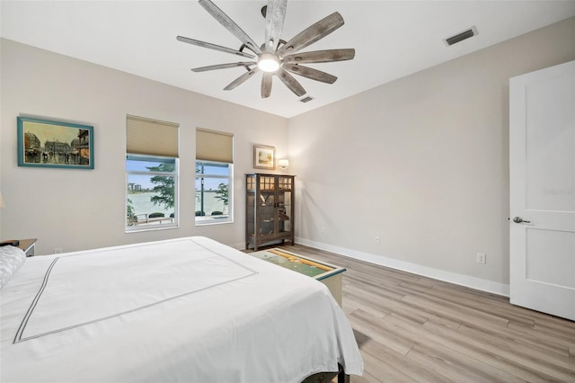 bedroom featuring ceiling fan and light hardwood / wood-style floors