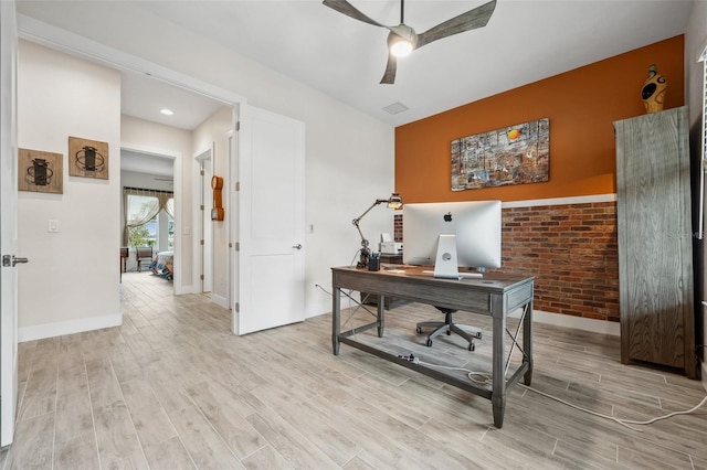 home office with ceiling fan and light wood-type flooring