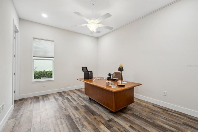 office with ceiling fan and dark wood-type flooring