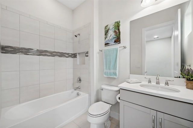 full bathroom with toilet, vanity, tile patterned floors, and tiled shower / bath