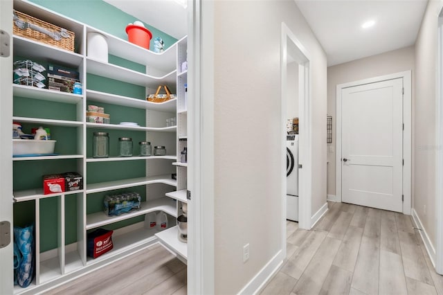 interior space featuring light wood-type flooring and washer / clothes dryer