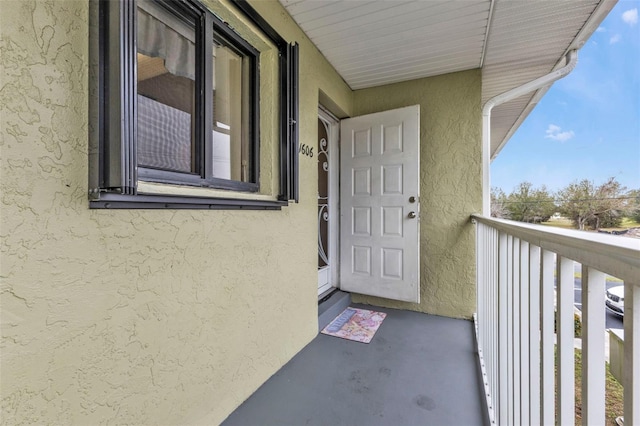 entrance to property with a balcony