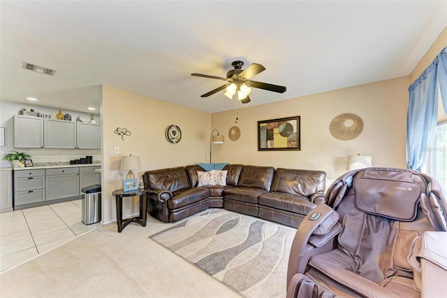 living room with light tile patterned floors and ceiling fan