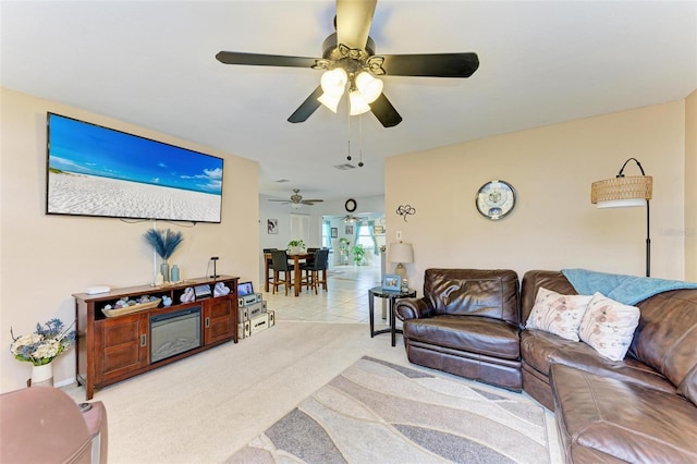 living room featuring ceiling fan and light carpet