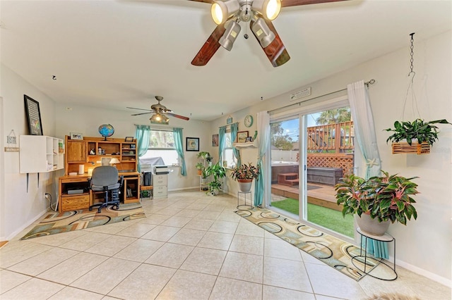 tiled office featuring ceiling fan