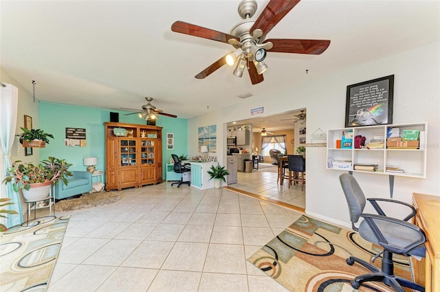 tiled office featuring ceiling fan