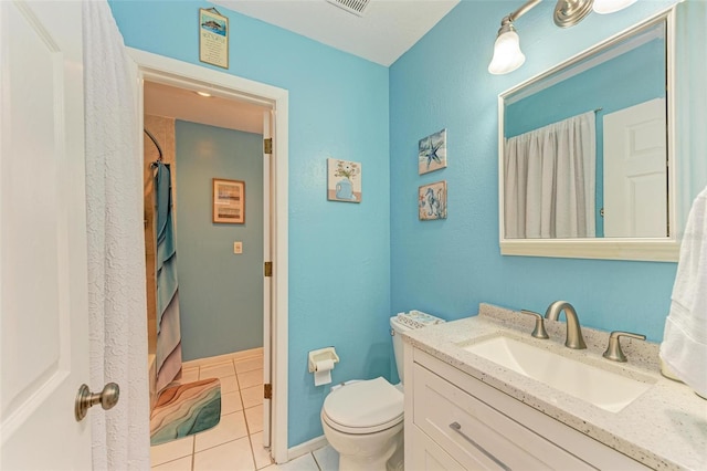 bathroom with tile patterned flooring, vanity, curtained shower, and toilet