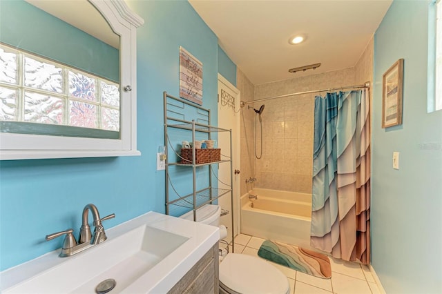 full bathroom with tile patterned floors, vanity, toilet, and shower / tub combo