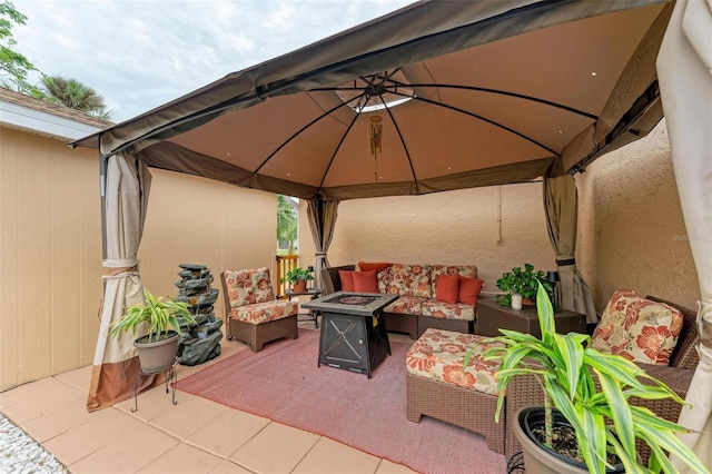 view of patio / terrace with a gazebo and an outdoor living space with a fire pit