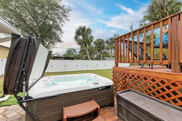 wooden terrace with a hot tub