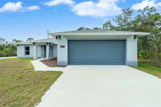 ranch-style home featuring a front lawn and a garage