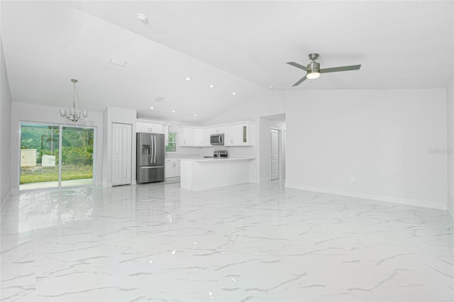 unfurnished living room with lofted ceiling and ceiling fan with notable chandelier