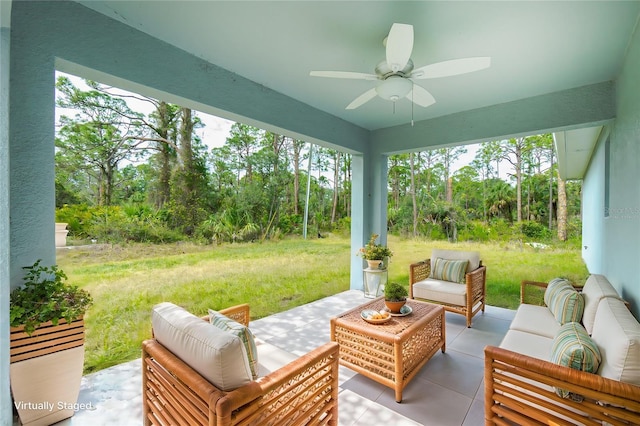 view of patio / terrace with ceiling fan and an outdoor living space