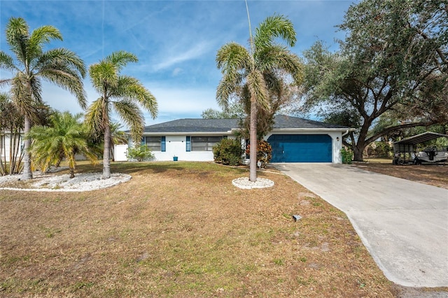 view of front of home featuring a garage and a front lawn