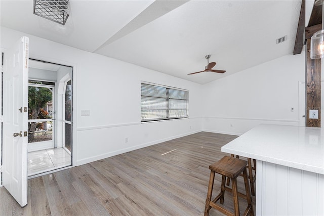 interior space featuring ceiling fan, vaulted ceiling, and hardwood / wood-style floors