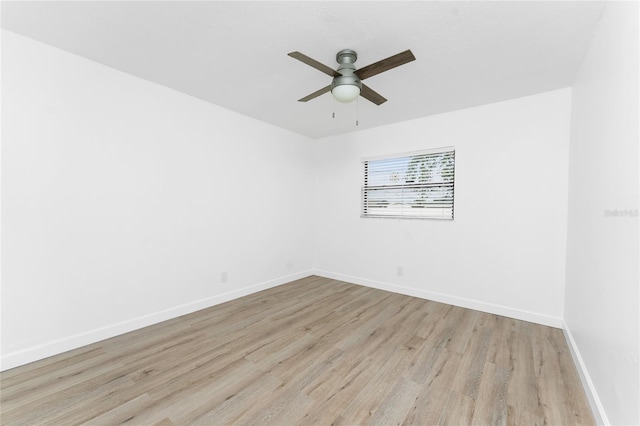 spare room with light hardwood / wood-style floors and ceiling fan