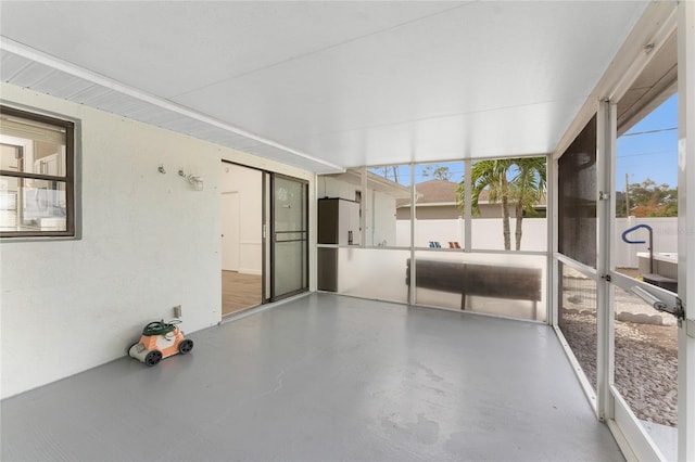 unfurnished sunroom featuring a healthy amount of sunlight