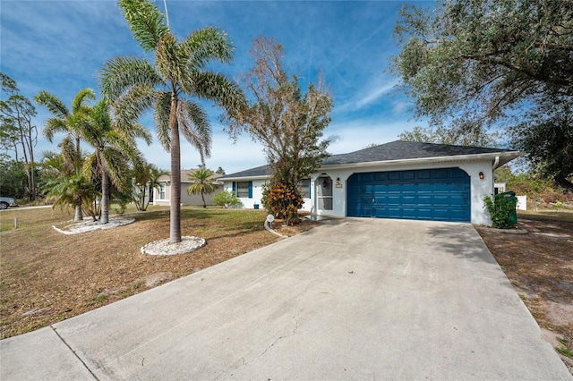 single story home with a garage and a front lawn