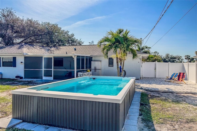 view of swimming pool with a sunroom