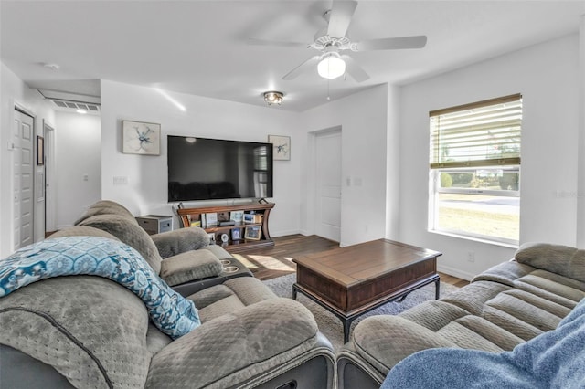 living room with hardwood / wood-style flooring and ceiling fan