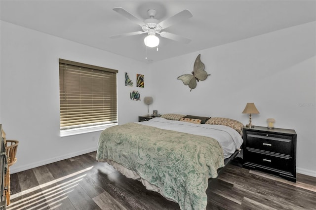 bedroom with ceiling fan and dark wood-type flooring