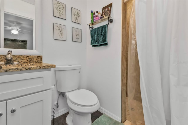 bathroom featuring hardwood / wood-style floors, vanity, a shower with curtain, ceiling fan, and toilet