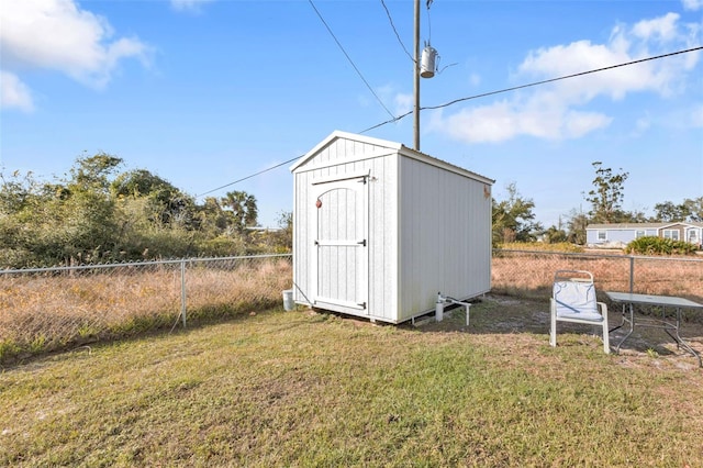 view of outdoor structure with a yard